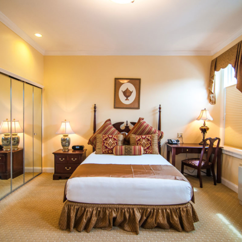 Gothic Garden, queen bed with closet and bedside desk